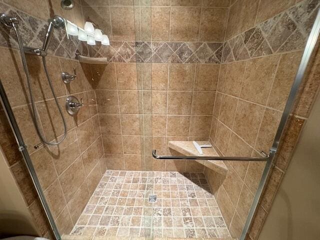 full bathroom with a shower stall