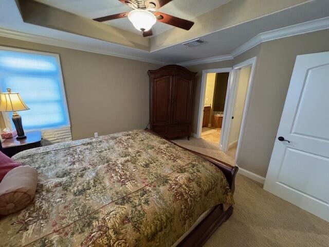 bedroom with crown molding, a raised ceiling, visible vents, light carpet, and baseboards