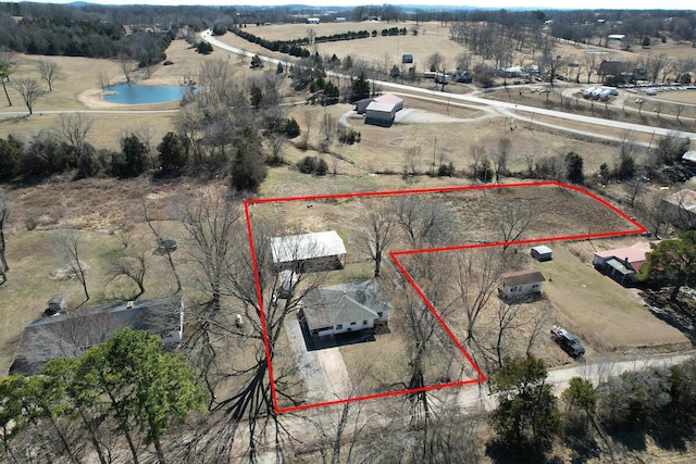 bird's eye view featuring a water view and a rural view