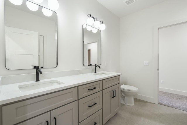 bathroom featuring baseboards, visible vents, a sink, and toilet