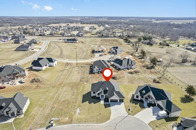 birds eye view of property with a residential view