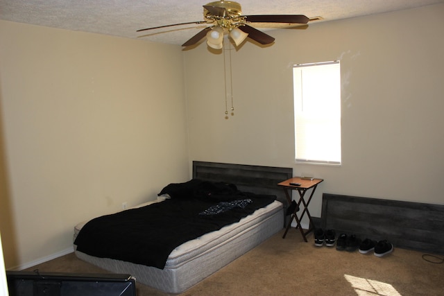 810 W College St, Springfield, MO 65806 - carpeted bedroom featuring a ceiling fan and a textured ceiling