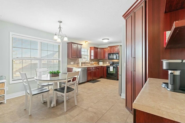 dining room featuring light tile patterned floors, baseboards, and a notable chandelier