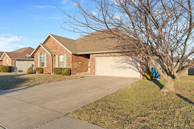 ranch-style house featuring a garage, brick siding, driveway, and a front lawn