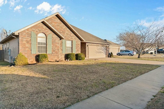 view of home's exterior featuring an attached garage, a lawn, concrete driveway, and brick siding