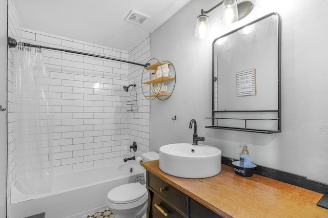 bathroom with toilet, tub / shower combination, vanity, and visible vents