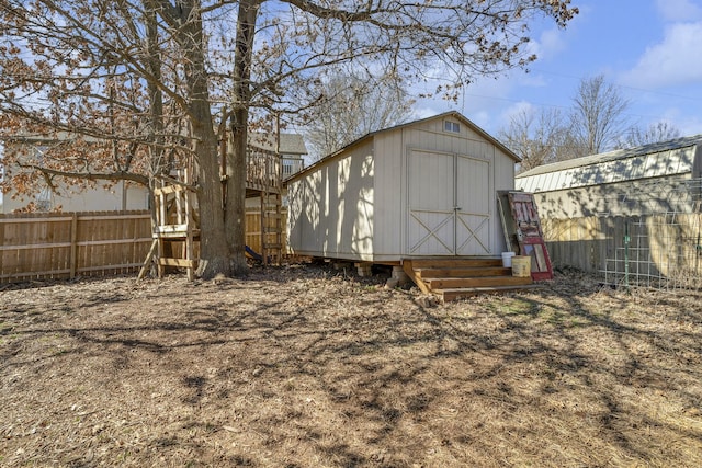 view of shed featuring fence private yard