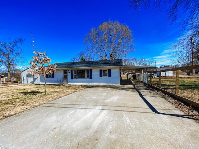 single story home featuring a carport and driveway