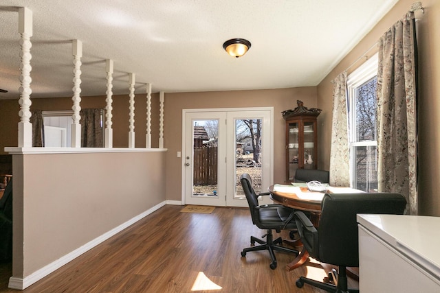 office featuring a textured ceiling, wood finished floors, and baseboards