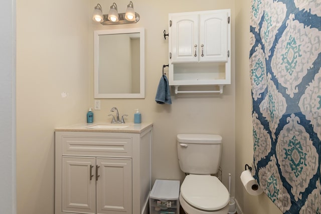 full bath with vanity and toilet