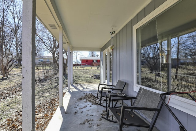 view of patio / terrace featuring visible vents and fence