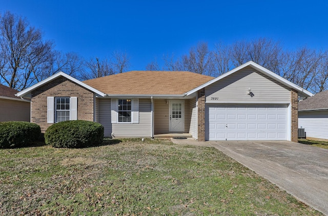 single story home featuring driveway, roof with shingles, an attached garage, a front lawn, and brick siding