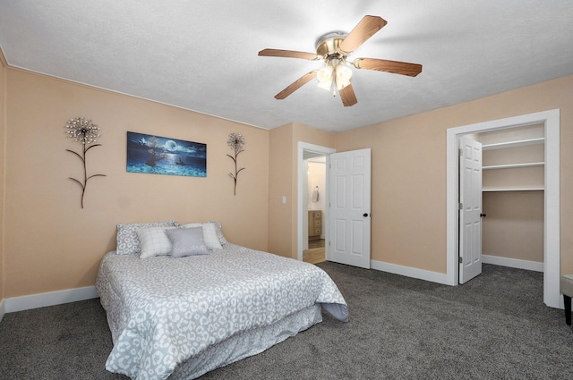 bedroom featuring dark colored carpet, ceiling fan, and baseboards