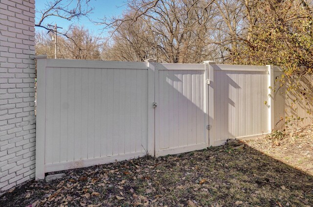 view of gate featuring fence