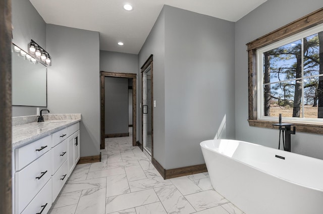 full bathroom with marble finish floor, recessed lighting, plenty of natural light, and baseboards