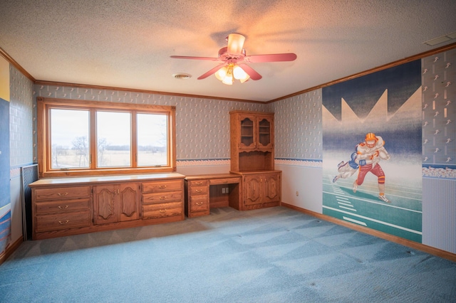 unfurnished office featuring light carpet, wallpapered walls, a textured ceiling, and crown molding