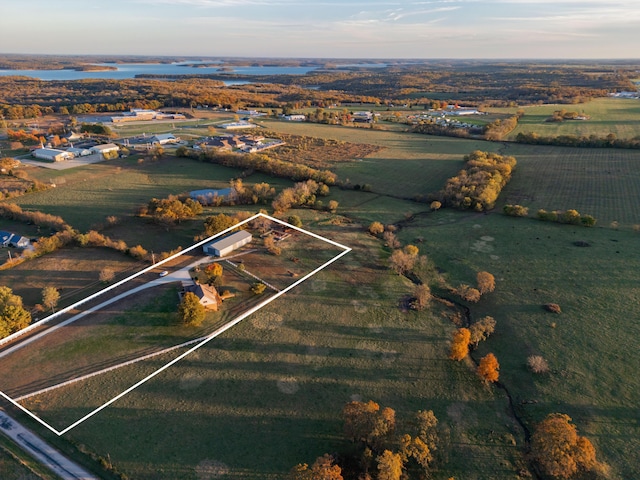 drone / aerial view featuring a rural view and a water view