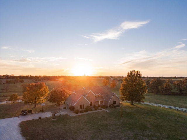 birds eye view of property with a rural view