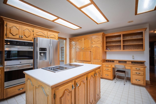 kitchen featuring stainless steel appliances, a center island, light countertops, and open shelves