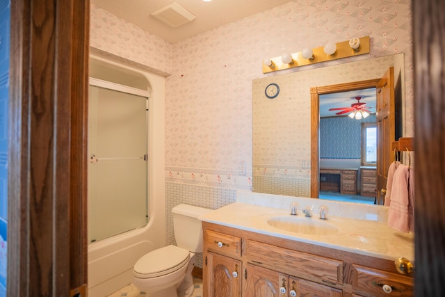 full bathroom with toilet, bath / shower combo with glass door, vanity, and wallpapered walls