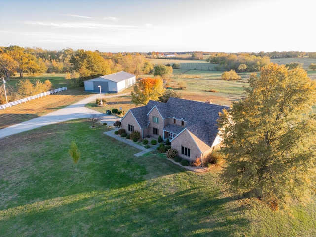 birds eye view of property with a rural view