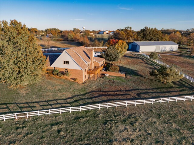 birds eye view of property with a rural view