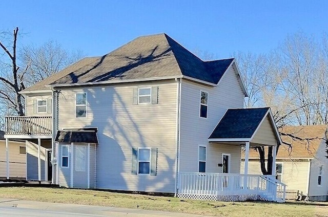 view of property exterior featuring covered porch