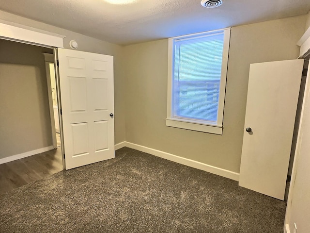 unfurnished bedroom featuring baseboards