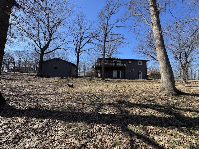 view of yard featuring an outbuilding and a wooden deck