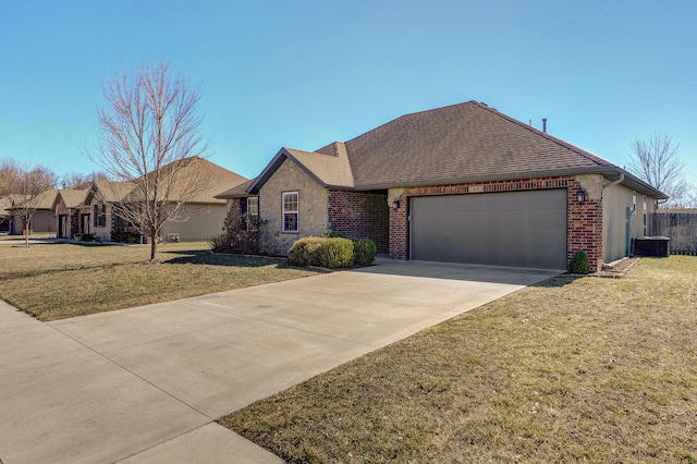 ranch-style house featuring a front yard, concrete driveway, and brick siding