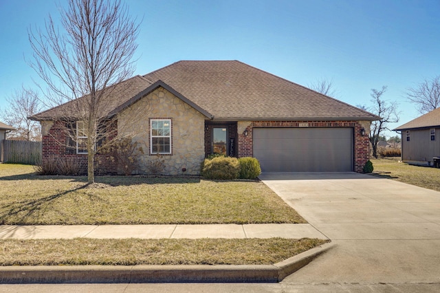 ranch-style house with an attached garage, brick siding, concrete driveway, stone siding, and a front lawn