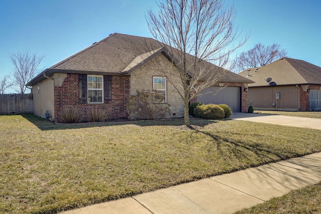 ranch-style home with a garage, a front lawn, concrete driveway, and brick siding