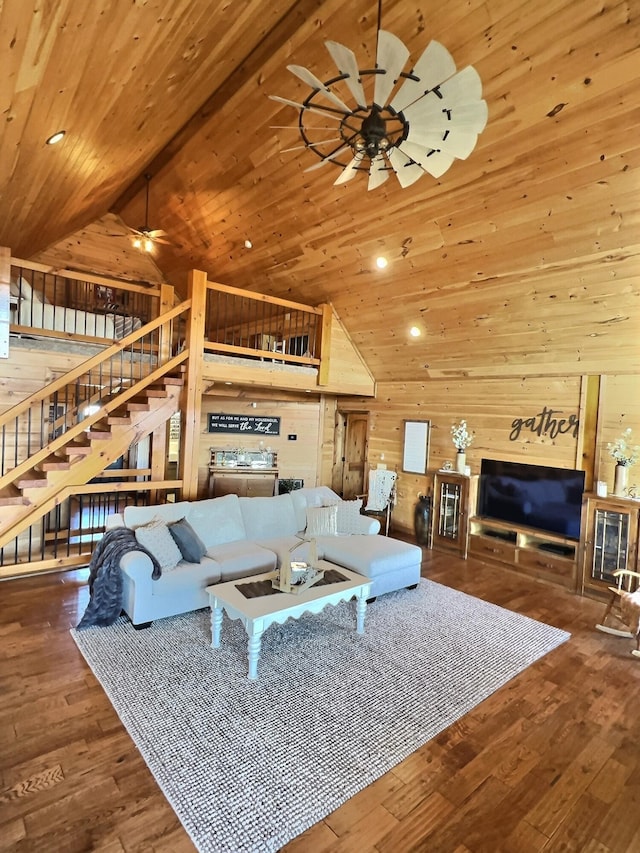 living area with high vaulted ceiling, wooden ceiling, wooden walls, and hardwood / wood-style flooring