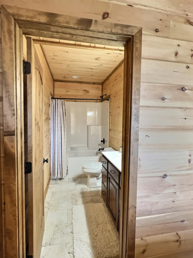 bathroom with shower / tub combo with curtain, stone tile floors, toilet, wood ceiling, and wooden walls