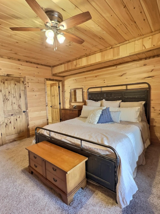 carpeted bedroom with wood ceiling, wood walls, and ceiling fan