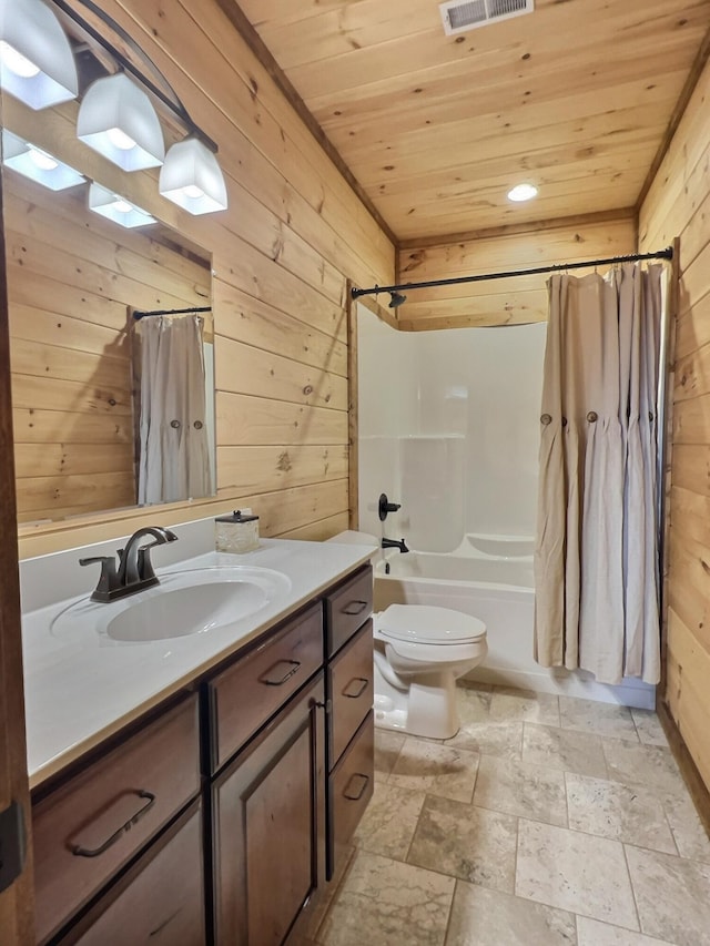 full bathroom with wooden walls, toilet, wooden ceiling, shower / tub combo with curtain, and vanity