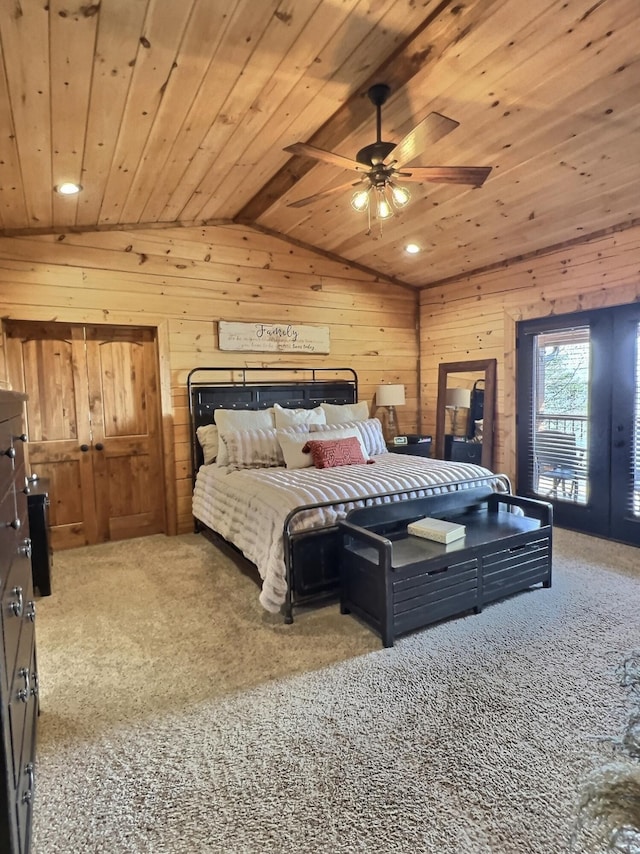 bedroom with lofted ceiling, carpet floors, wood ceiling, and wooden walls