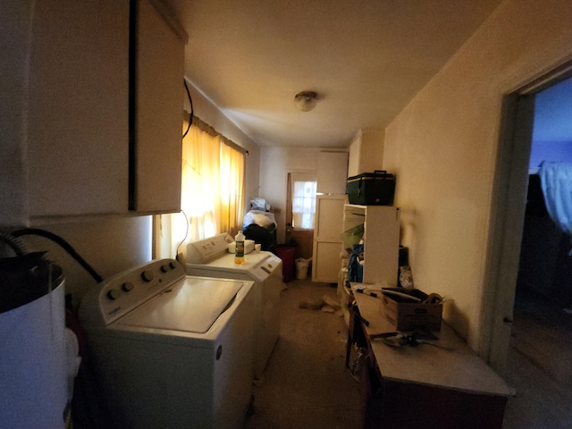 washroom with laundry area, washer and clothes dryer, and gas water heater