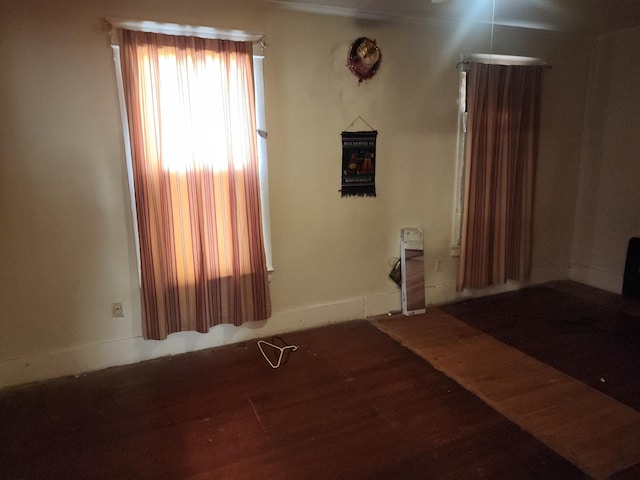 unfurnished room featuring wood finished floors