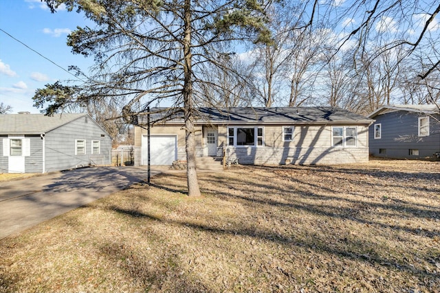 ranch-style house with a front yard, driveway, an attached garage, and fence