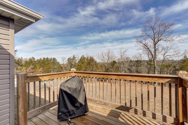 wooden terrace with area for grilling