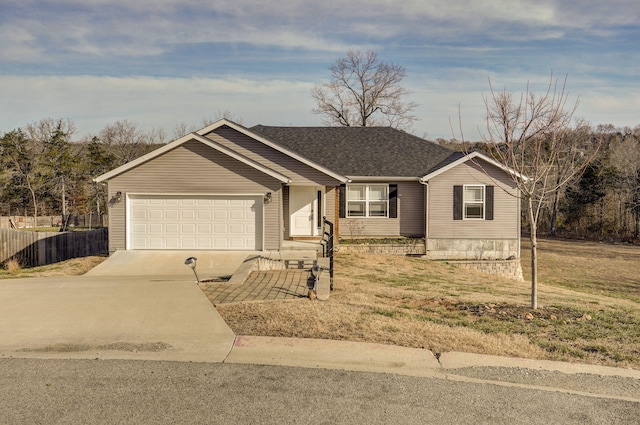 ranch-style home with an attached garage, a shingled roof, fence, concrete driveway, and a front lawn