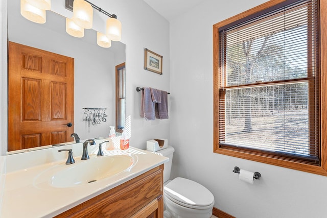 230 Temple Ln, Shell Knob, MO 65747 - half bathroom featuring toilet, vanity, and a wealth of natural light