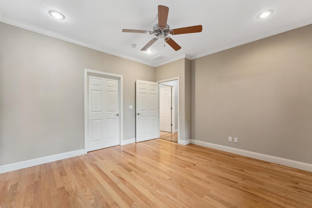 unfurnished bedroom with light wood-style floors, baseboards, and ornamental molding