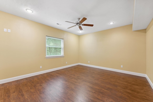 empty room with visible vents, baseboards, a ceiling fan, dark wood-style floors, and recessed lighting