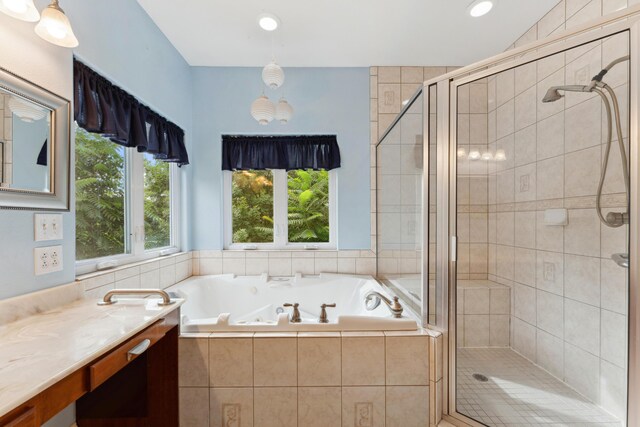 full bath featuring a whirlpool tub, a shower stall, vanity, and recessed lighting