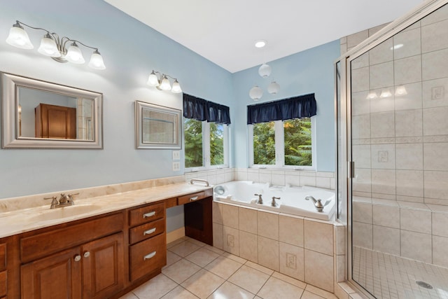 bathroom with a bath, tile patterned flooring, vanity, and a shower stall