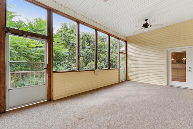 unfurnished sunroom featuring plenty of natural light and ceiling fan