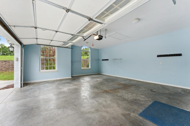 garage featuring baseboards and a garage door opener