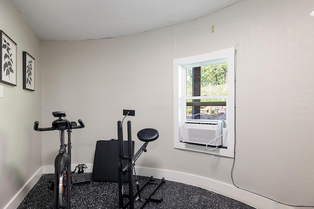 workout area with cooling unit and baseboards